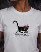 White t-shirt with a black cat graphic and 'Vacation Mode' text on a dark background